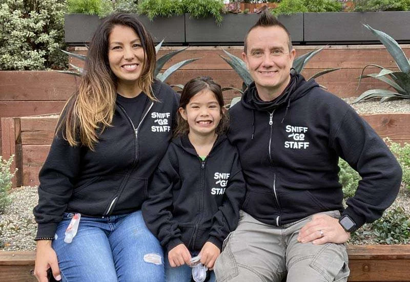 Emi, founder of Sniff and Go, with her family and Westie dogs